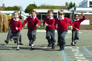 happy school children running
