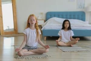 The two children are meditating